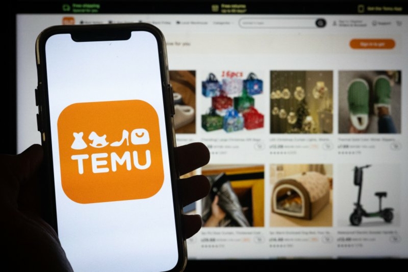 Temu-Handy-App-vor-Computerbildschirm-Copyright-stock-adobe-com---Tigarto.jpeg